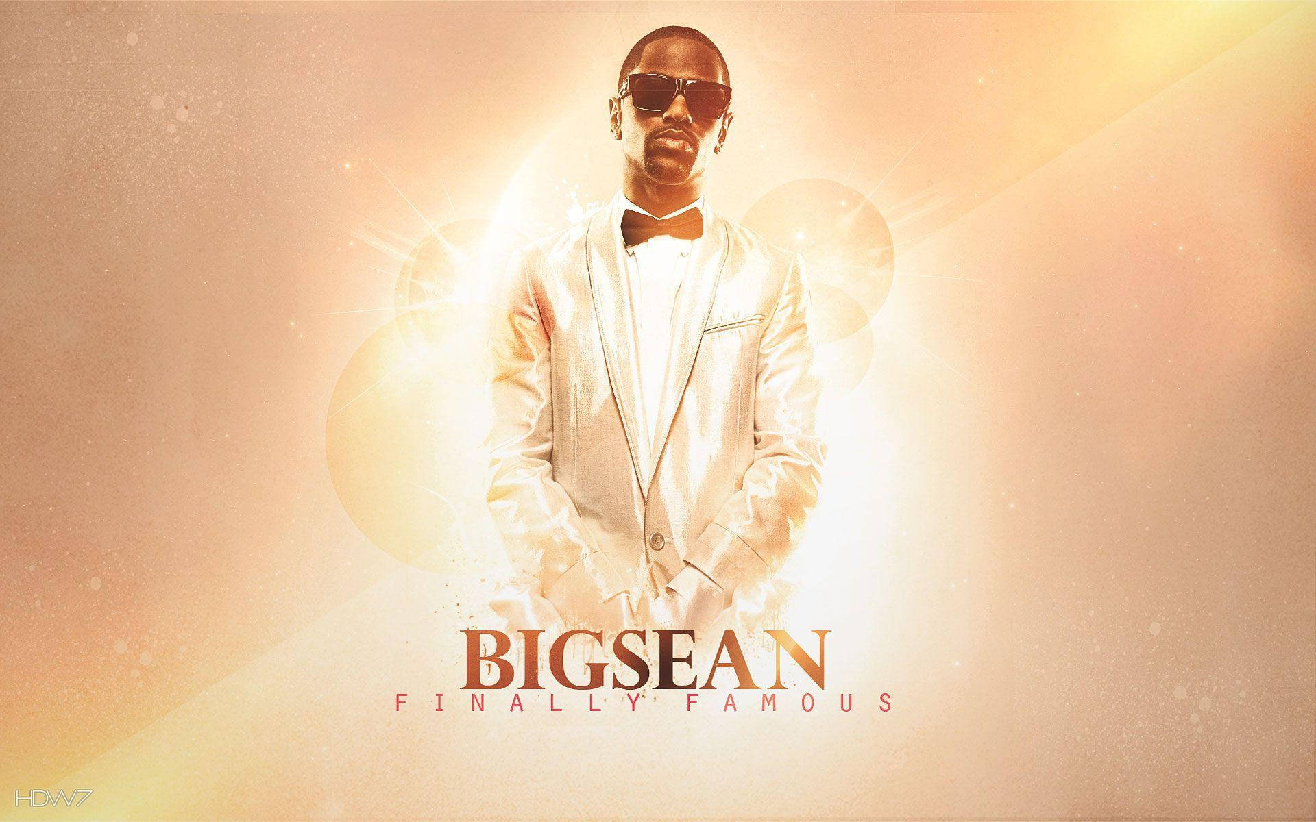 Big Sean 穿著白色西裝和太陽眼鏡，背景是閃耀的金色和文字。