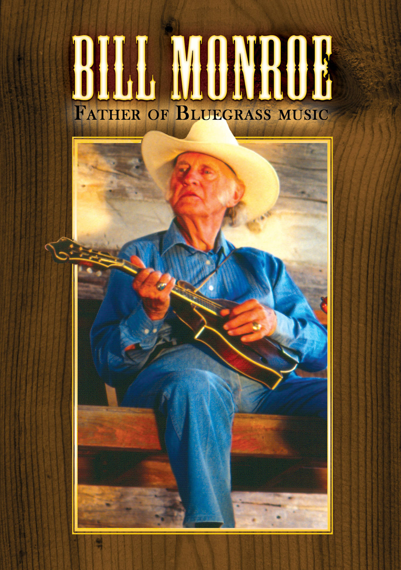 Bill Monroe，藍草音樂之父，在木框肖像中手持曼陀林。