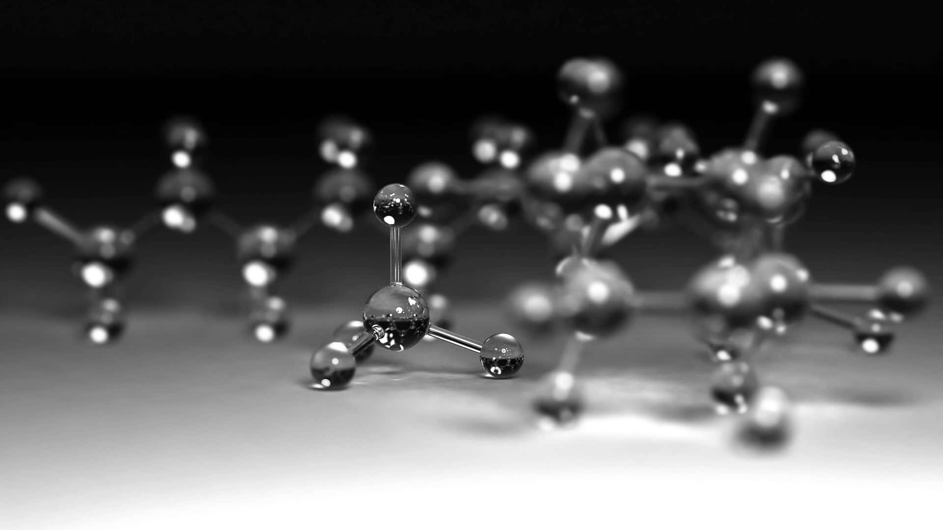 黑白工作室環境中金屬分子模型的淺景深照片。