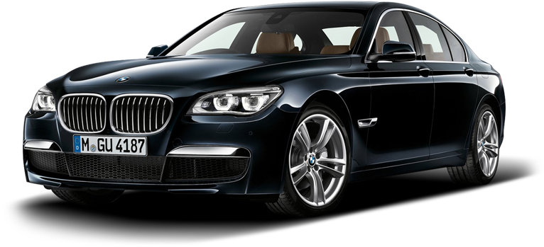 黑色BMW 7系列轎車 壁紙 — 一輛時尚的黑色BMW 7系轎車在攝影棚燈光下閃耀，展示其拋光鍍鉻格柵和合金輪圈。