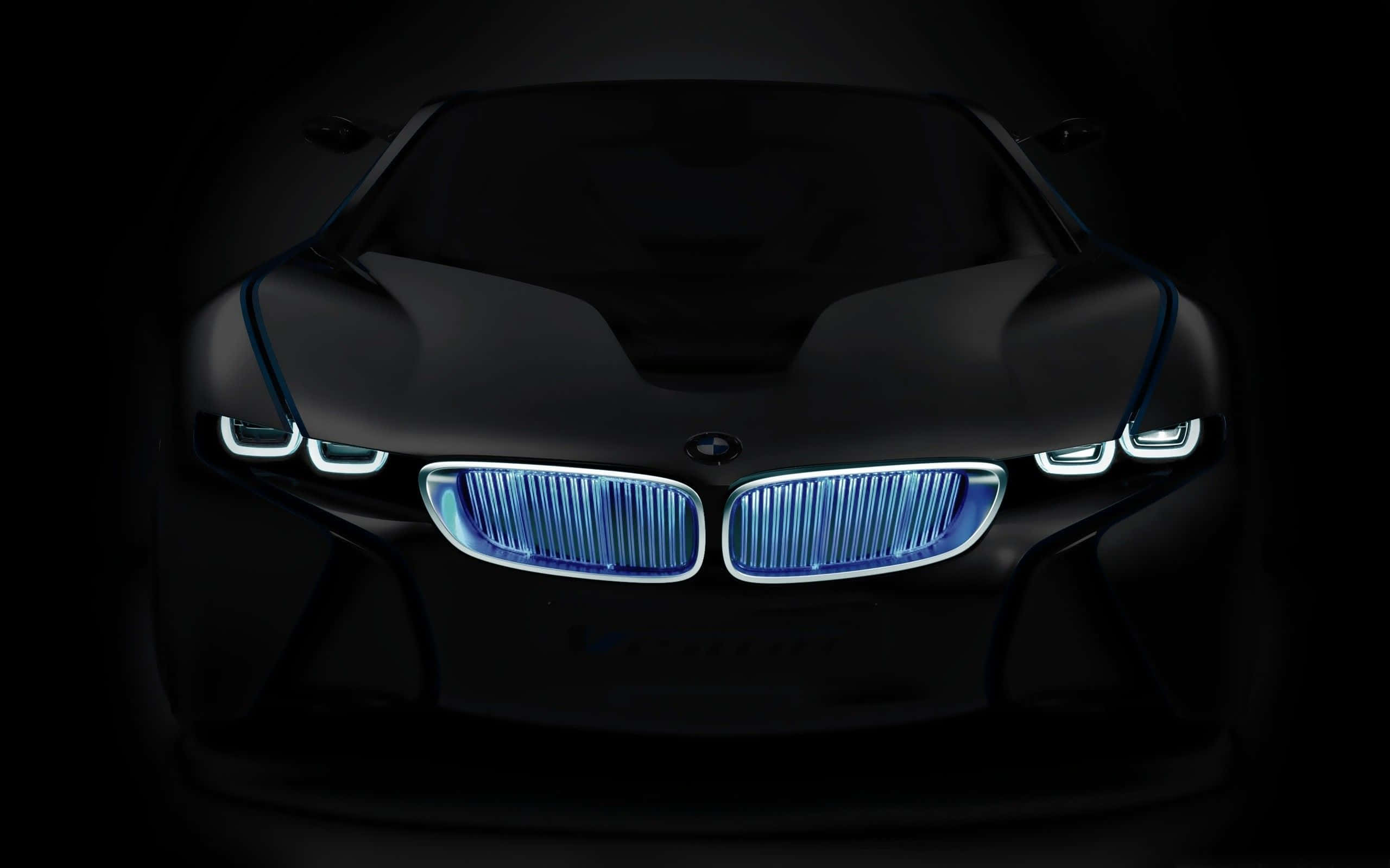 BMW M3發光前格柵平板壁紙 壁紙 — 一架時尚的黑色BMW概念車，在漆黑背景下散發出鮮豔的藍色頭燈和鬼面罩光芒。
