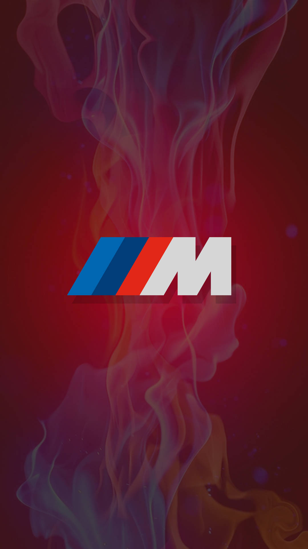 BMW M標誌被彩色煙霧環繞在紅色背景上