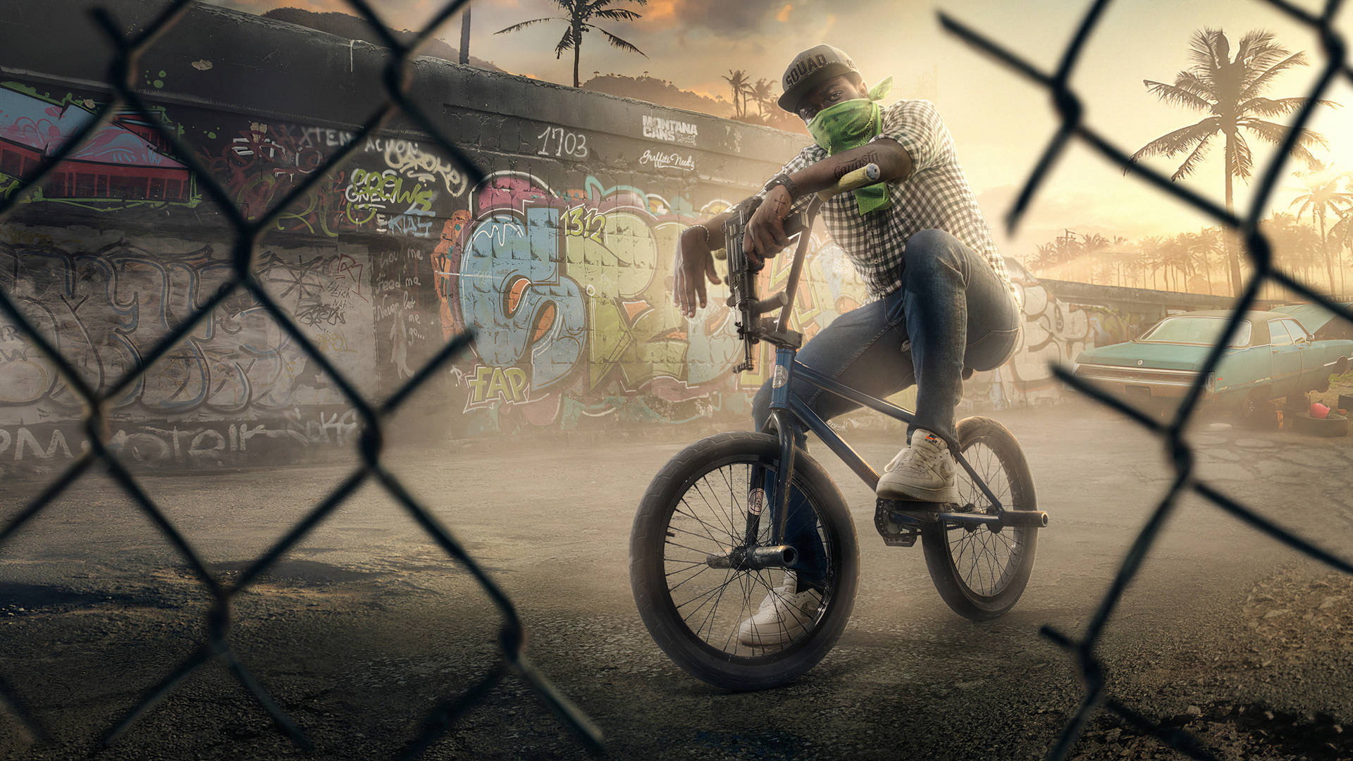 BMX車手在夕陽下靠著單車在鐵絲網圍欄後