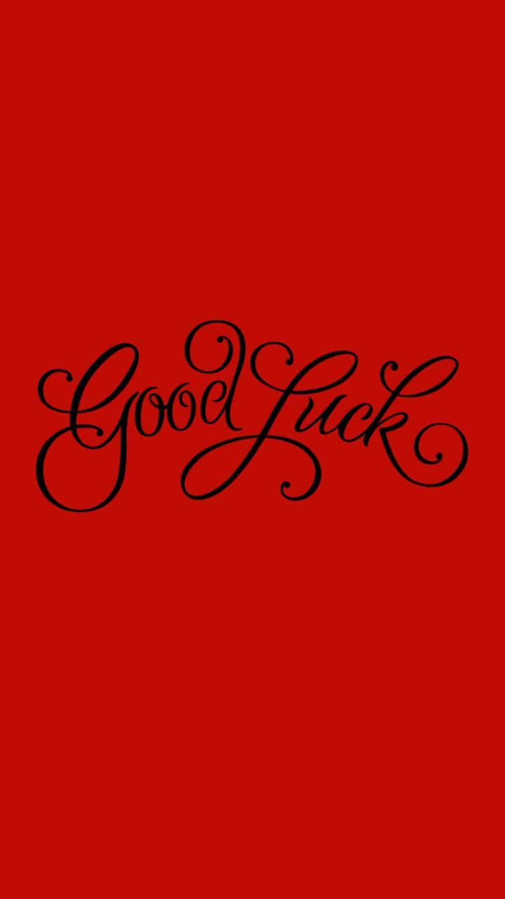  壁紙 — 粗體黑色草書文字「Good Luck」居中顯示在純紅色背景上。