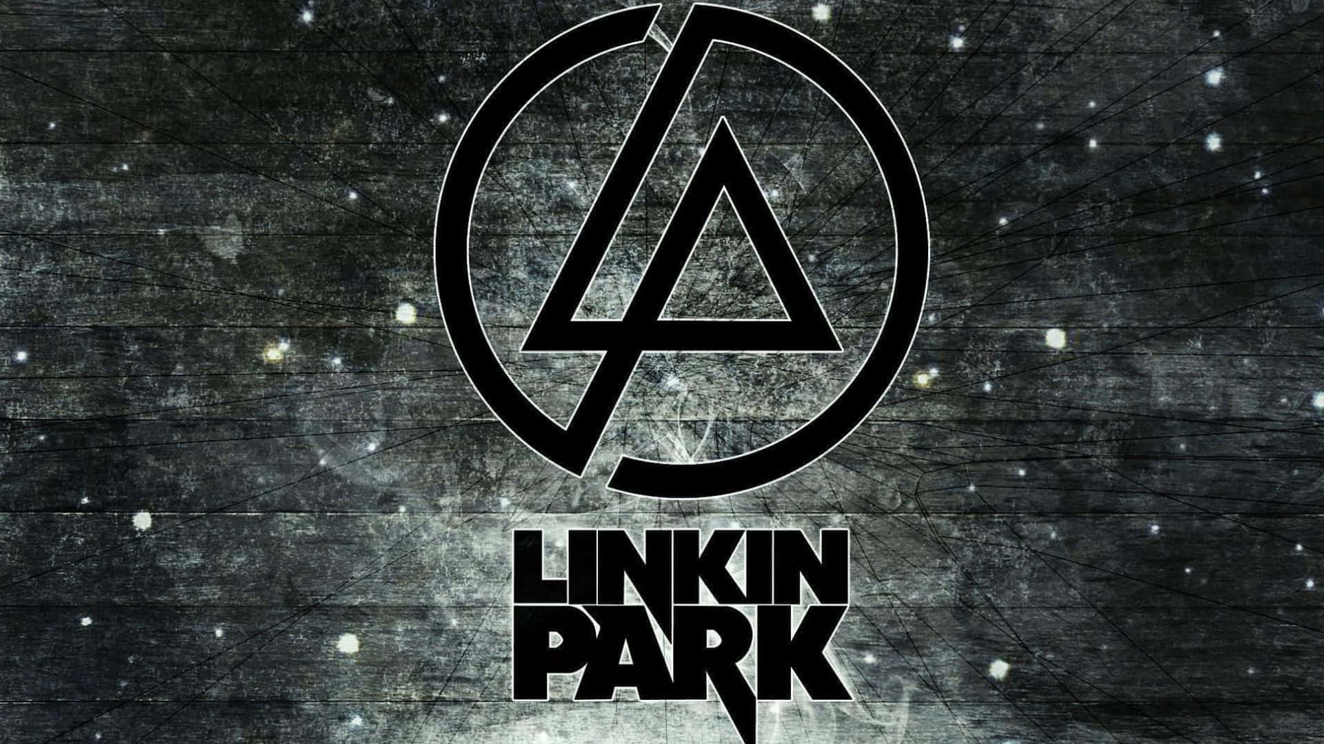  壁紙 — 大膽的黑色Linkin Park標誌置中於粗糙紋理的深灰色背景上，帶有散落的白色斑點。