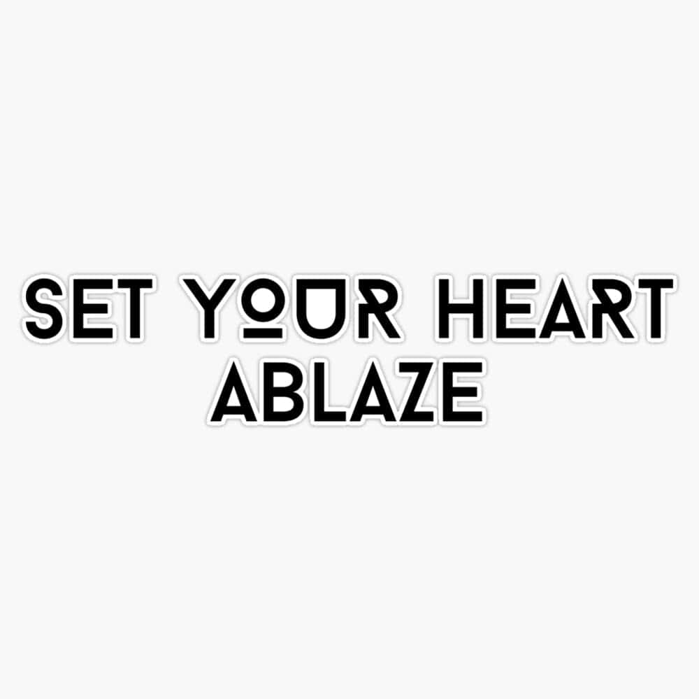  壁紙 — 粗體黑色文字在純淺灰色背景上顯示 set your heart ablaze。