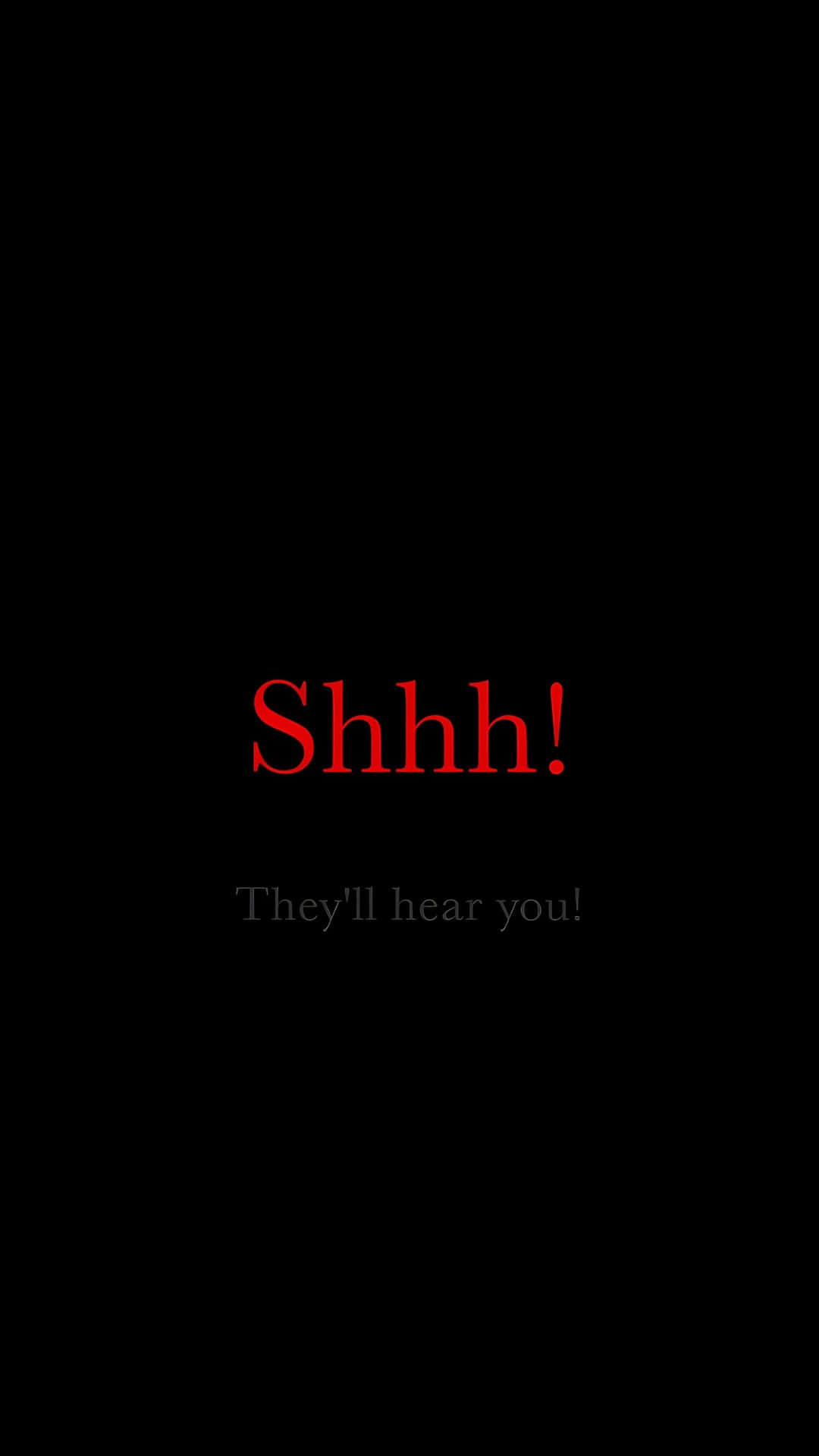  壁紙 — 粗體紅色文字警告「Shhh!」，背景為純黑色，並帶有微妙的灰色後續訊息。