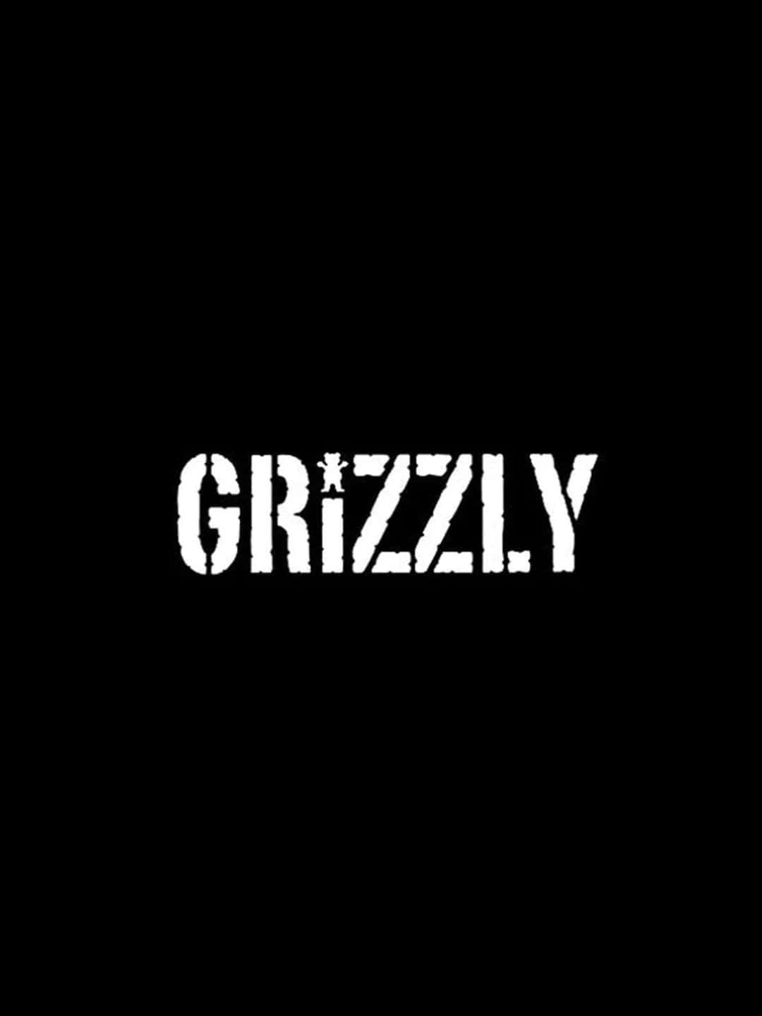  壁紙 — 粗體白色模板字 'GRIZZLY' 居中於純黑色背景上，帶有磨損紋理。