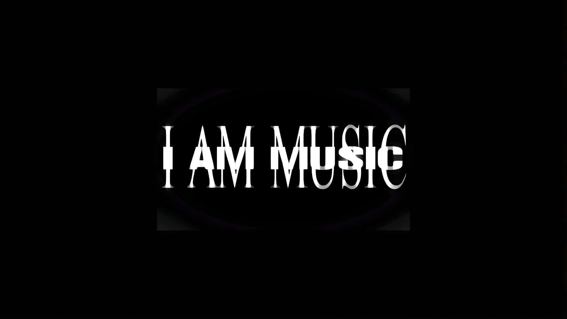 壁紙 — 粗體白色文字「I AM MUSIC」居中顯示在黑色背景上，帶有微妙的圓形發光效果。
