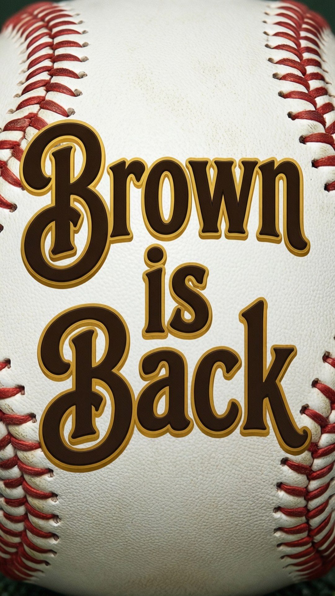 一個帶有紅色縫線和棕色及金色文字 'Brown is Back' 的棒球。