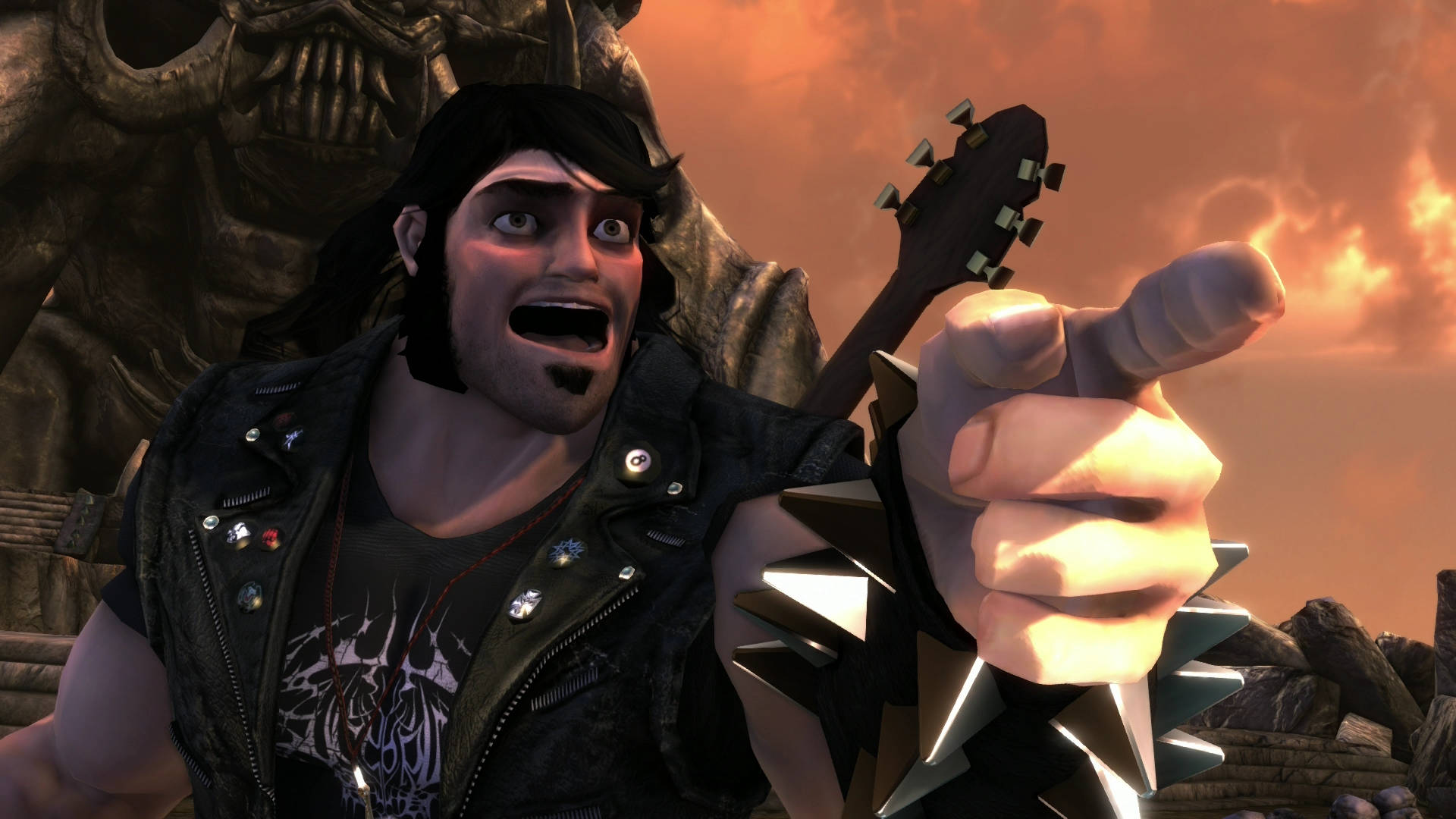 《Brutal Legend》艾迪·里格斯搖滾造型 壁紙 — 一個長黑髮、戴尖刺護臂的龐克搖滾樂手，在火橙色天空下拿著結他指向前面。