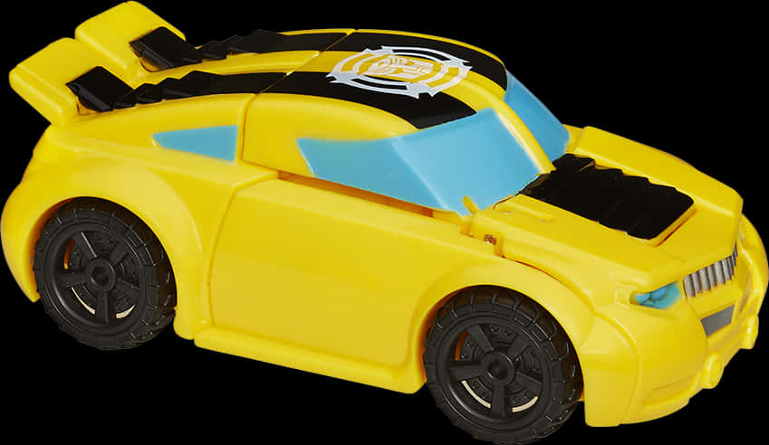 變形金剛Bumblebee玩具車 壁紙 — 一輛亮黃色玩具賽車，帶有黑色和藍色點綴，車頂有白色徽章。