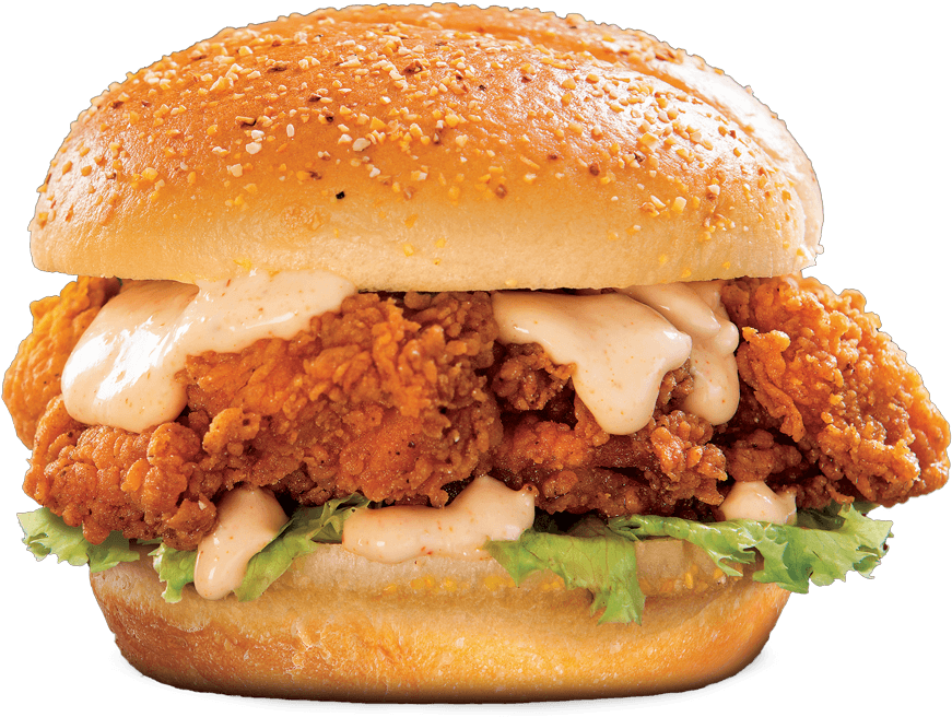 Burger King 香脆雞堡 壁紙 — 一個脆皮炸雞三明治的特寫，配有奶油醬和生菜，放在芝麻麵包上，背景為黑色。