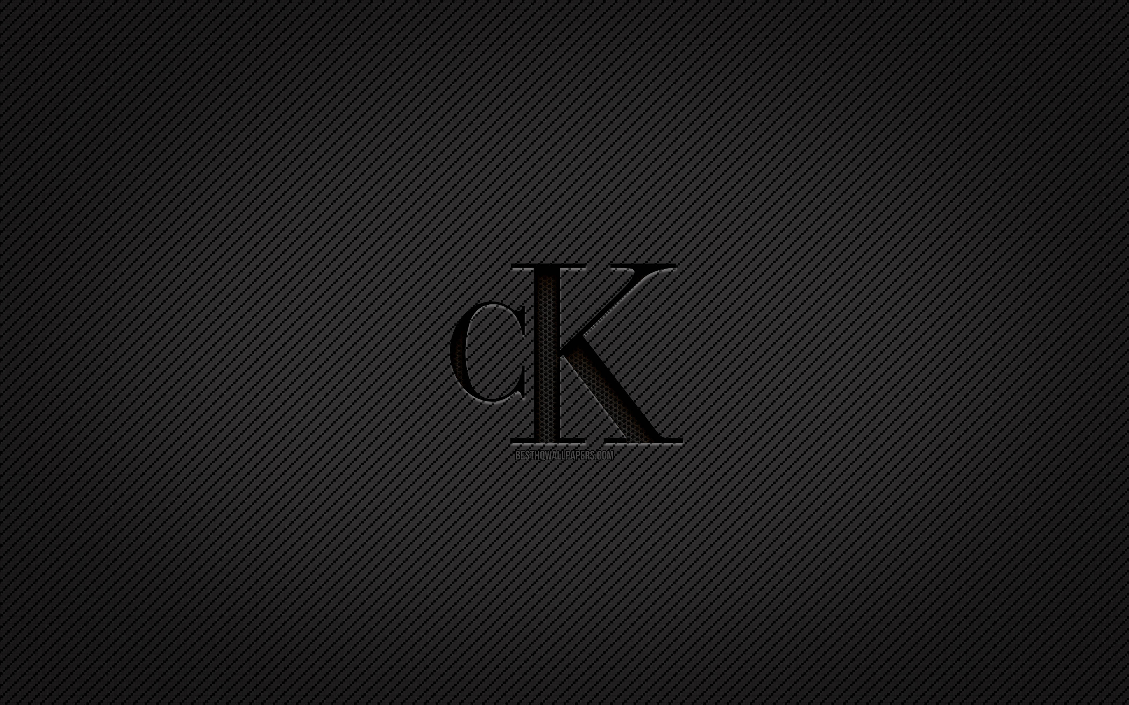 Calvin Klein 黑色標誌 壁紙 — 時尚黑色碳纖維背景，中央帶有低調的CK標誌，採用極簡單色設計。