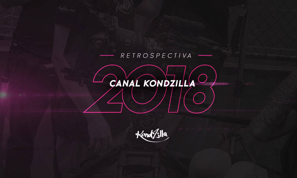 粉紅色霓虹文字「Retrospectiva 2018 Canal Kondzilla」在黑暗模糊的滑板場景上。