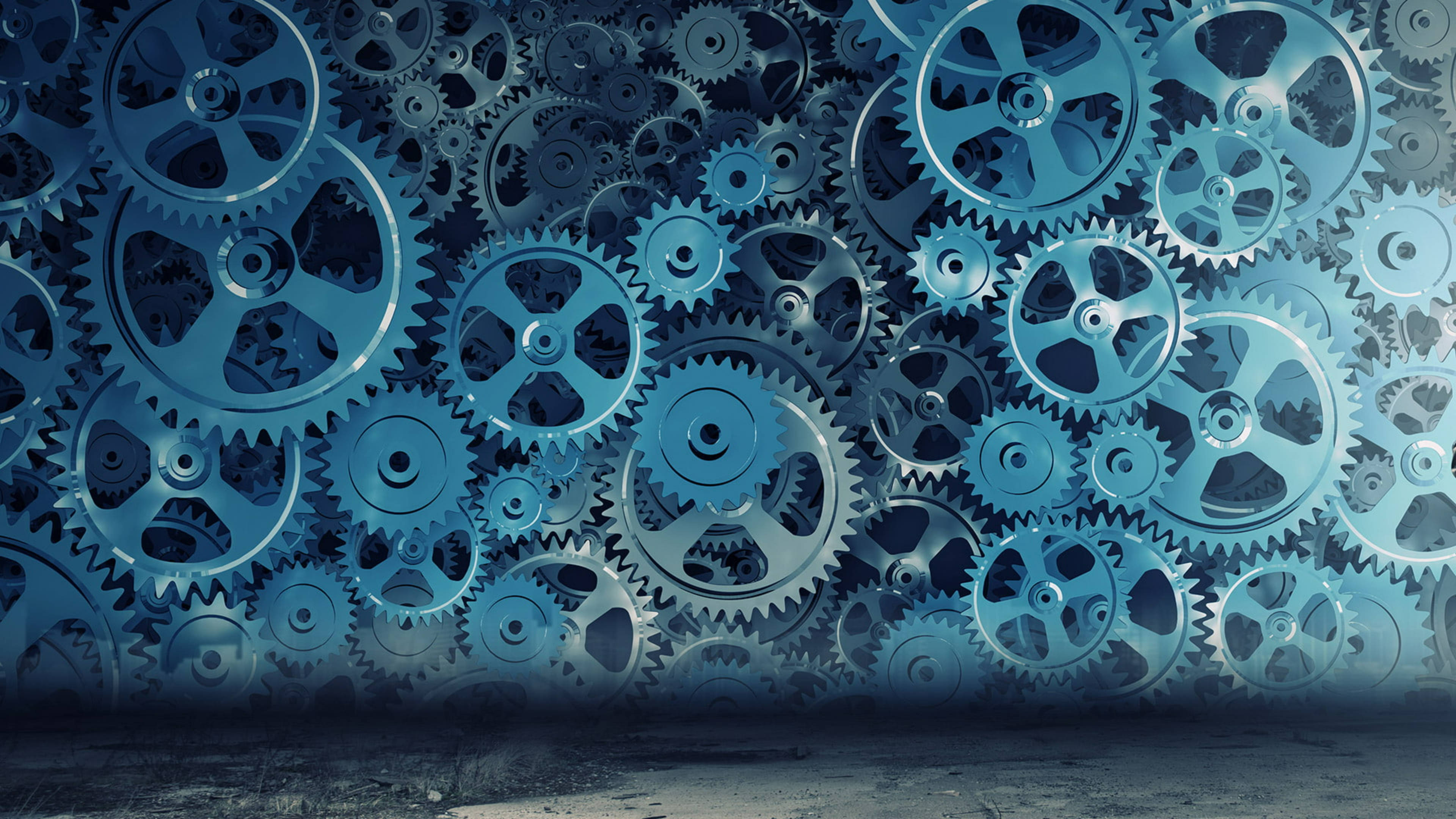 Canva 數位機械藝術 壁紙 — 一堵由相互交錯的藍色金屬齒輪組成的密集牆壁，營造出複雜的機械背景，下方是深色混凝土地板。