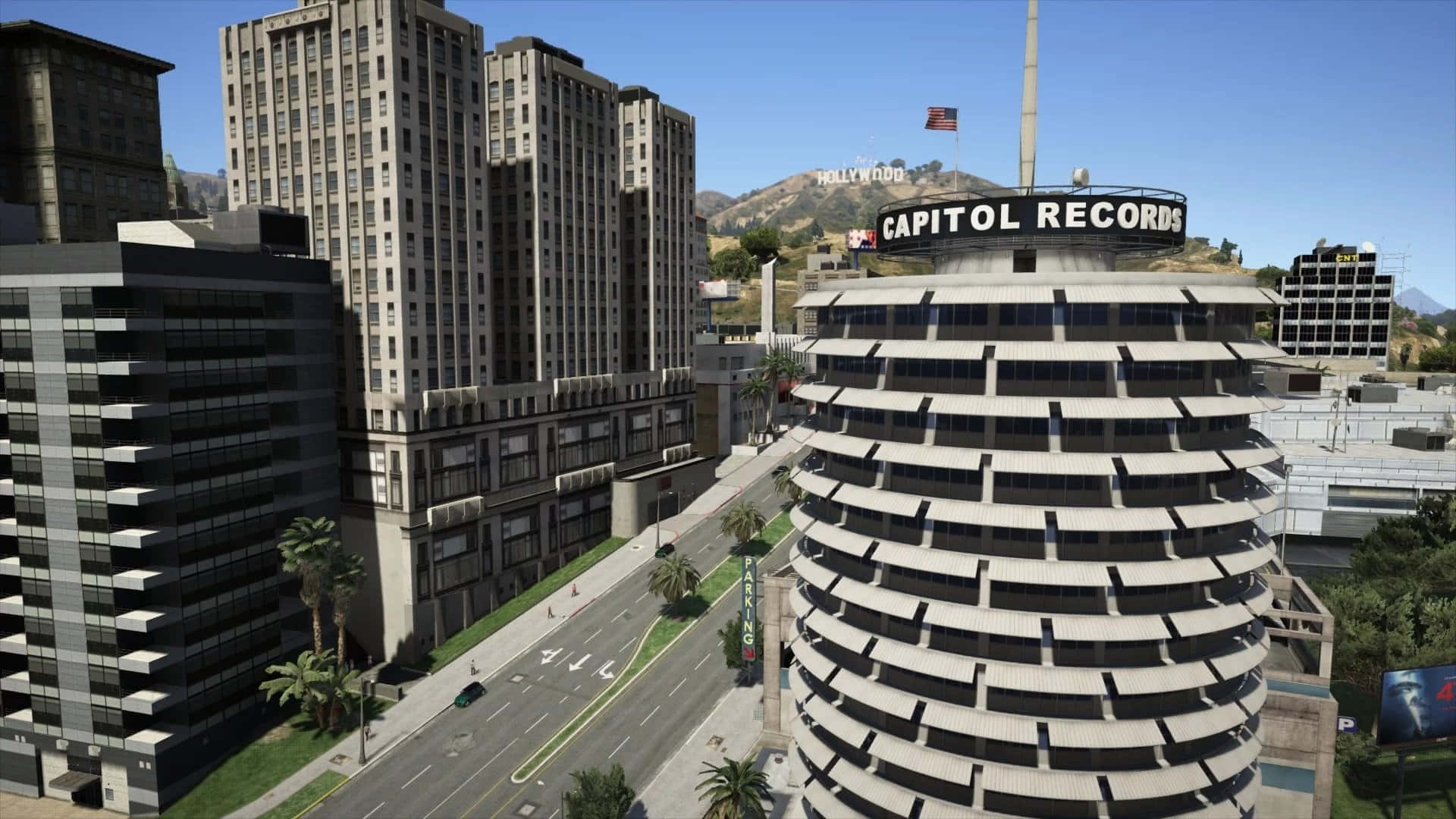 Capitol Records大樓傲然挺立 壁紙 — 洛杉磯標誌性 Capitol Records 大樓的晴朗日景，遠處山丘上可見荷里活標誌。