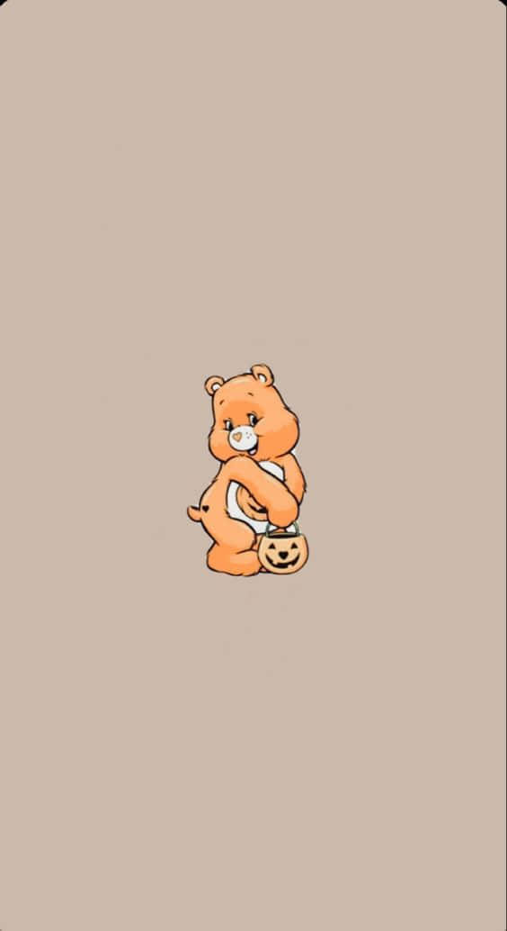 可愛美學Care Bear為用戶帶來笑容 壁紙 — 一隻細小的橙色卡通熊，在純米色背景上拿著一個傑克南瓜燈桶。