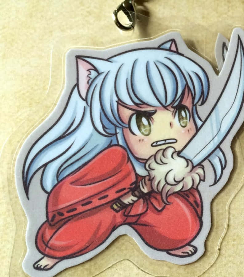 Inuyasha And Tessaiga 桌布 壁紙 — 銀髮貓耳Q版動漫角色在透明亞加力鎖匙扣上以兇猛姿態握劍。