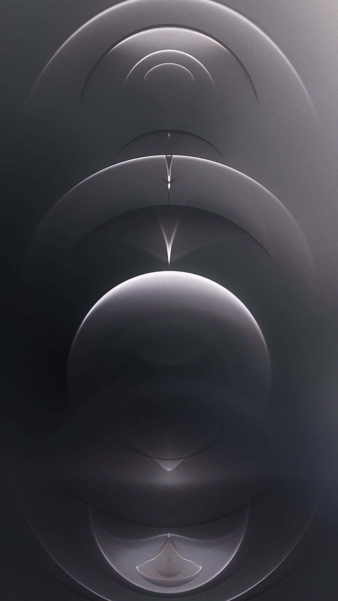  壁紙 — 抽象同心銀環在深色漸變背景上柔和發光，帶有微妙的光暈。