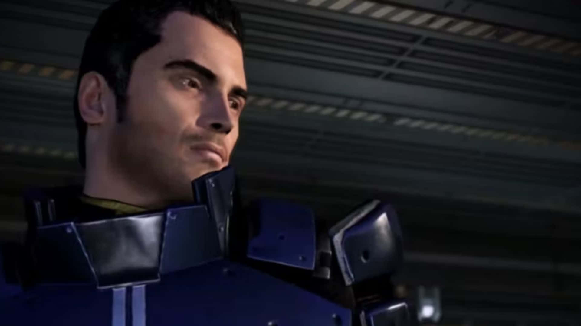 Kaidan Alenko 桌布 壁紙 — 一個嚴肅的男人穿著深藍色裝甲裝備在工業照明下的特寫。