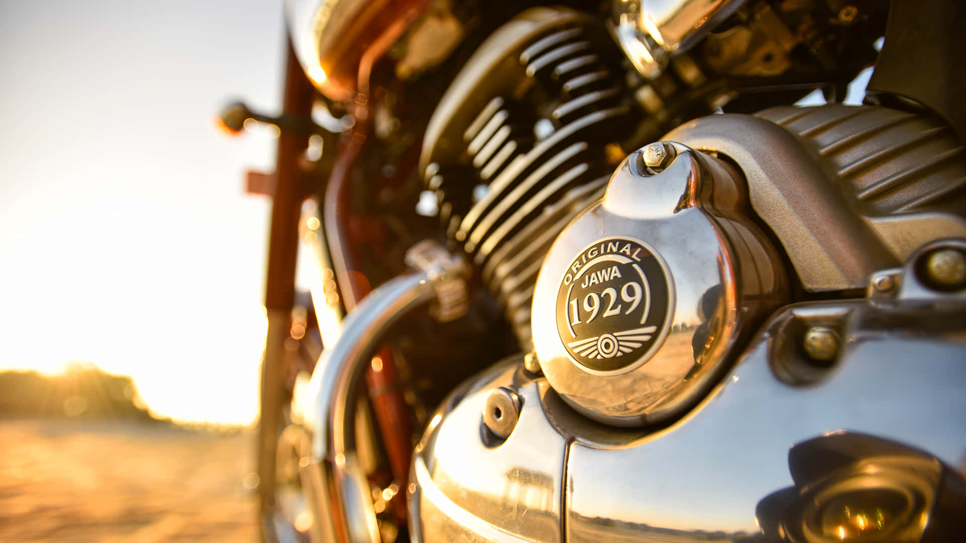  壁紙 — 復古Jawa 1929電單車引擎在金色夕陽光下閃爍的特寫。