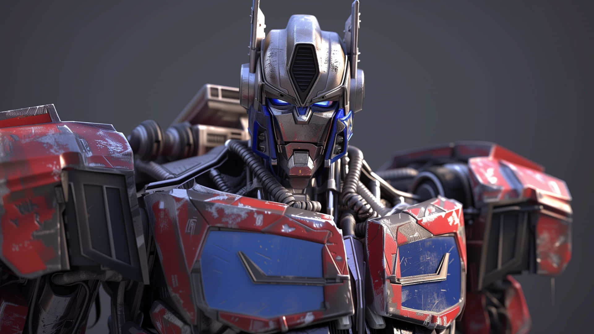  壁紙 — Optimus Prime 嘅特寫，佢有發光嘅藍色眼睛同埋風化嘅紅色同藍色裝甲，背景係深灰色。
