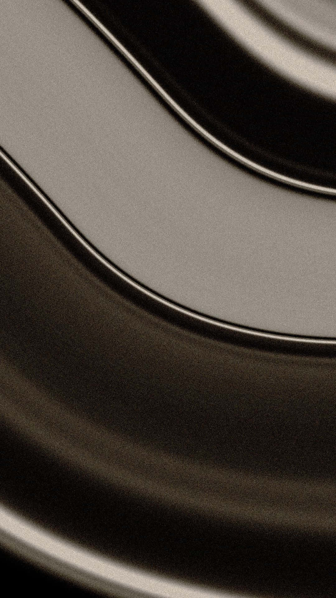  壁紙 — 光滑金屬曲線的特寫，帶有柔和漸變和單色調中的細微反射。