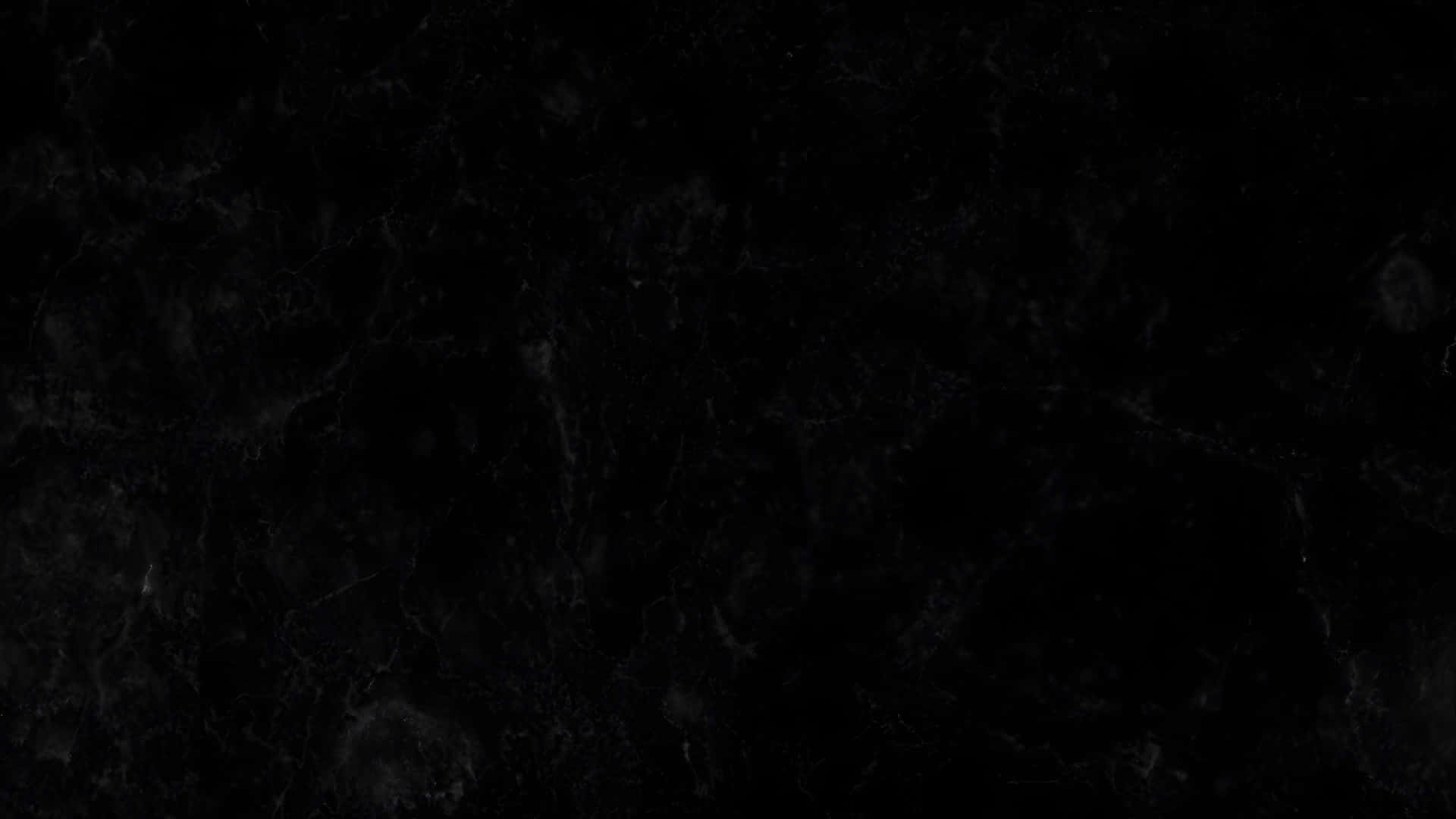  壁紙 — 黑色光滑大理石表面的特寫，帶有細微的灰色紋理和拋光反射飾面。