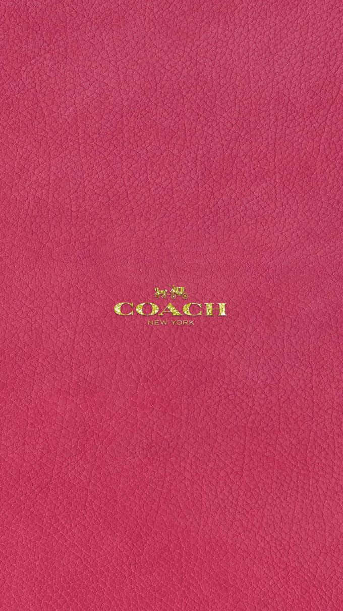 粉紅色皮革 Coach 銀包，金色標誌