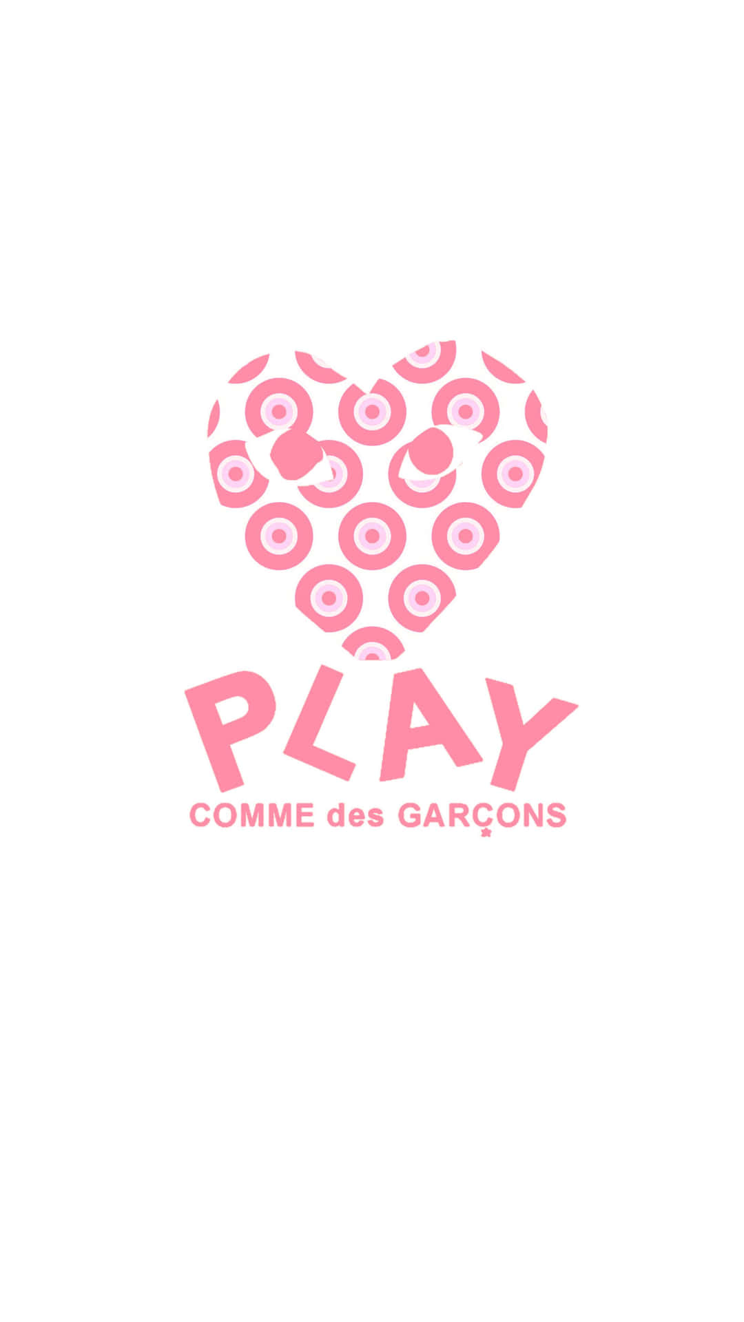 帶有同心圓和文字PLAY COMME des GARÇONS的粉紅色心形標誌
