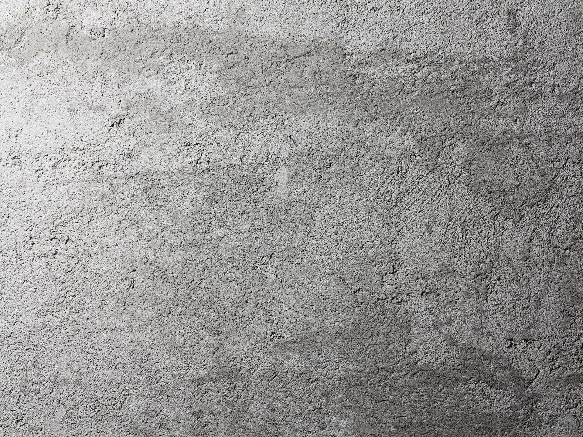 灰色混凝土牆紋理的特寫，粗糙表面細節。