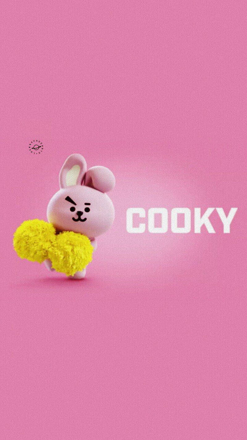 Cooky BT21 可愛3D 壁紙 — 一個可愛的粉紅色兔仔角色手持黃色絨球，站在純粉紅色背景前，背景上有白色文字 'COOKY'。