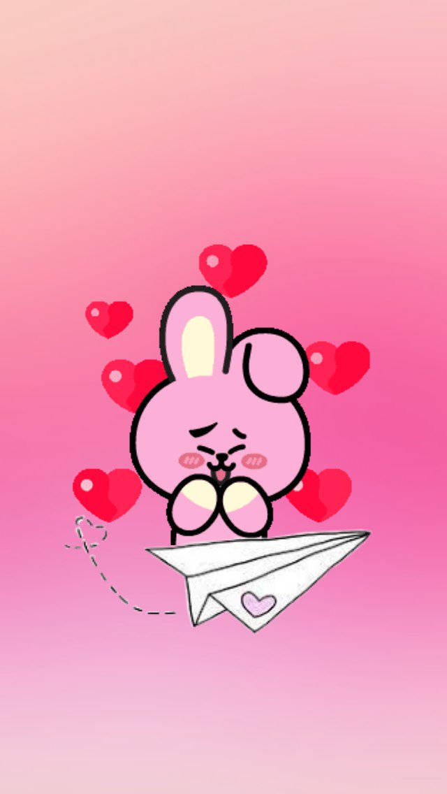 Cooky BT21 心形與紙飛機 壁紙 — 一隻可愛的粉紅色卡通兔子，臉頰紅潤，坐在紙飛機上，周圍漂浮著紅色愛心，背景是漸變粉紅色。
