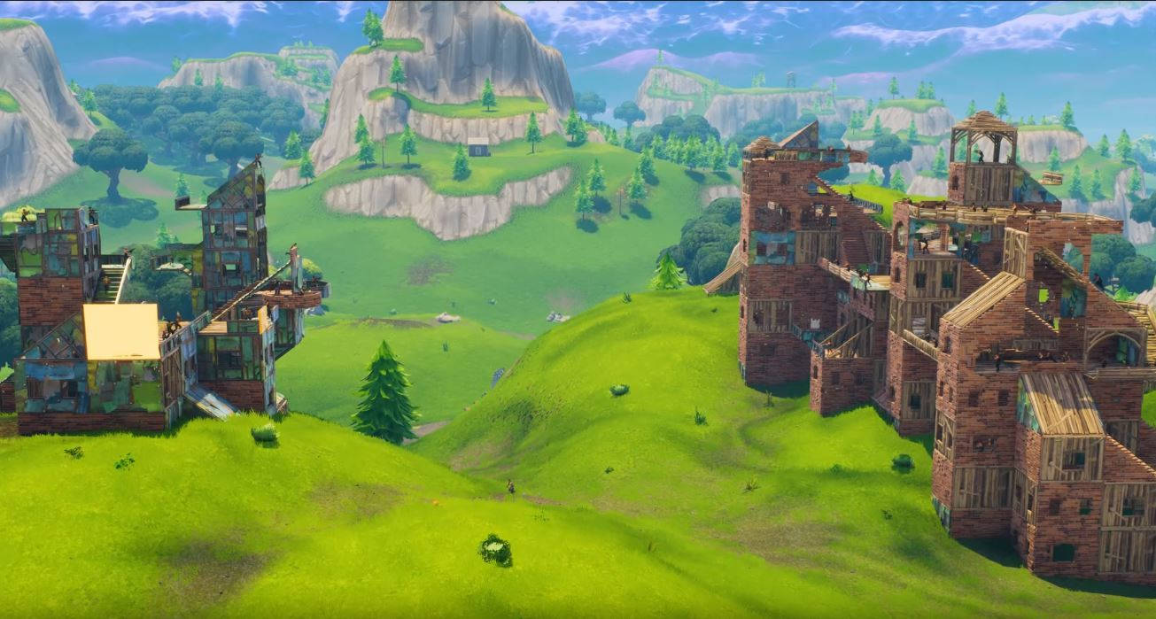 Fortnite 遊戲景觀，藍天下綠色山丘上的木質建築。