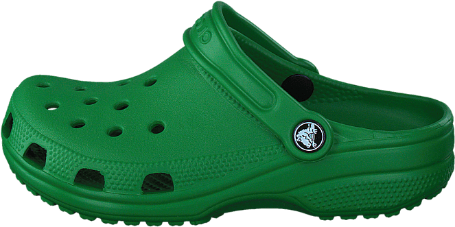 綠色Crocs涼鞋側視圖 壁紙 — 一隻亮綠色 Croc 木屐鞋孤立在黑色背景上，具有可見紋理和通風孔。