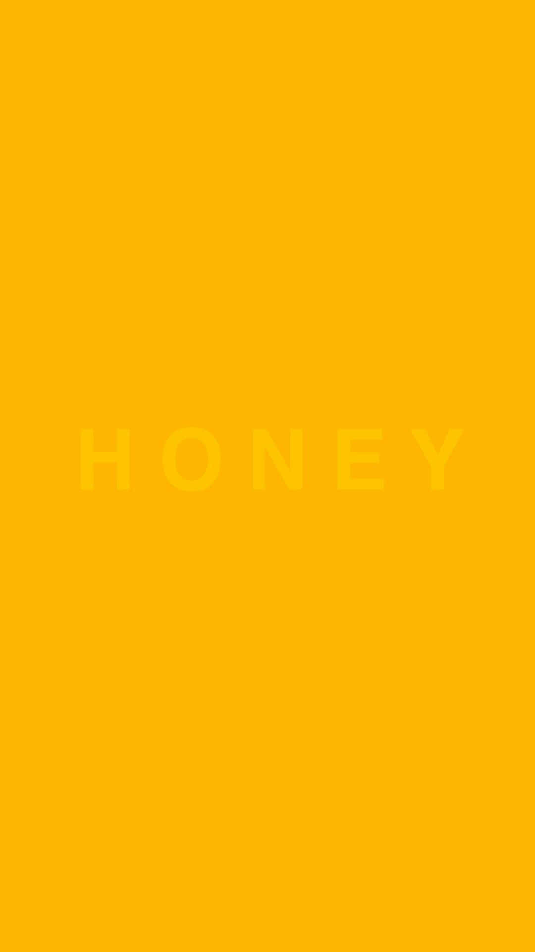 Solid Yellow 桌布 壁紙 — 大膽的黃色背景，中間有淺黃色的文字HONEY。