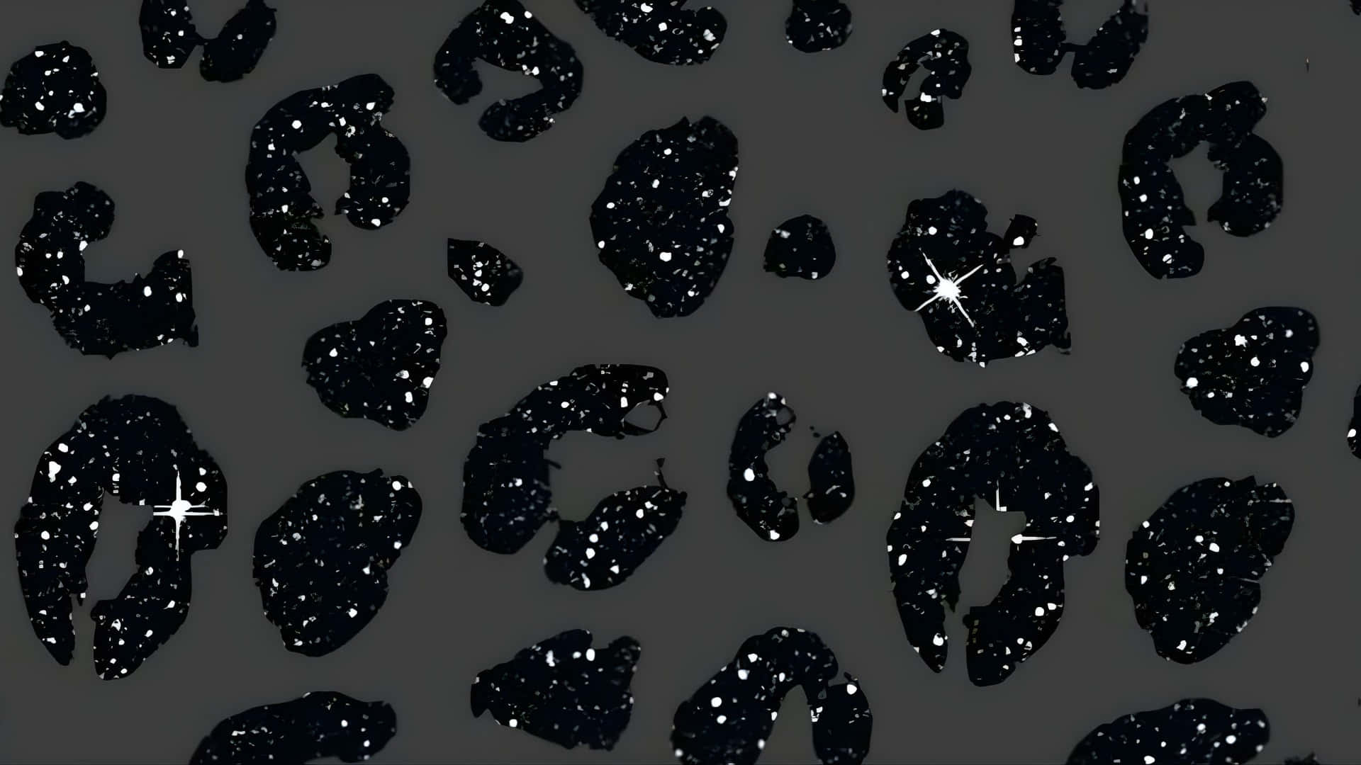  壁紙 — 深灰色背景，飾有閃閃發光的黑色豹紋斑點，像星星一樣閃爍。