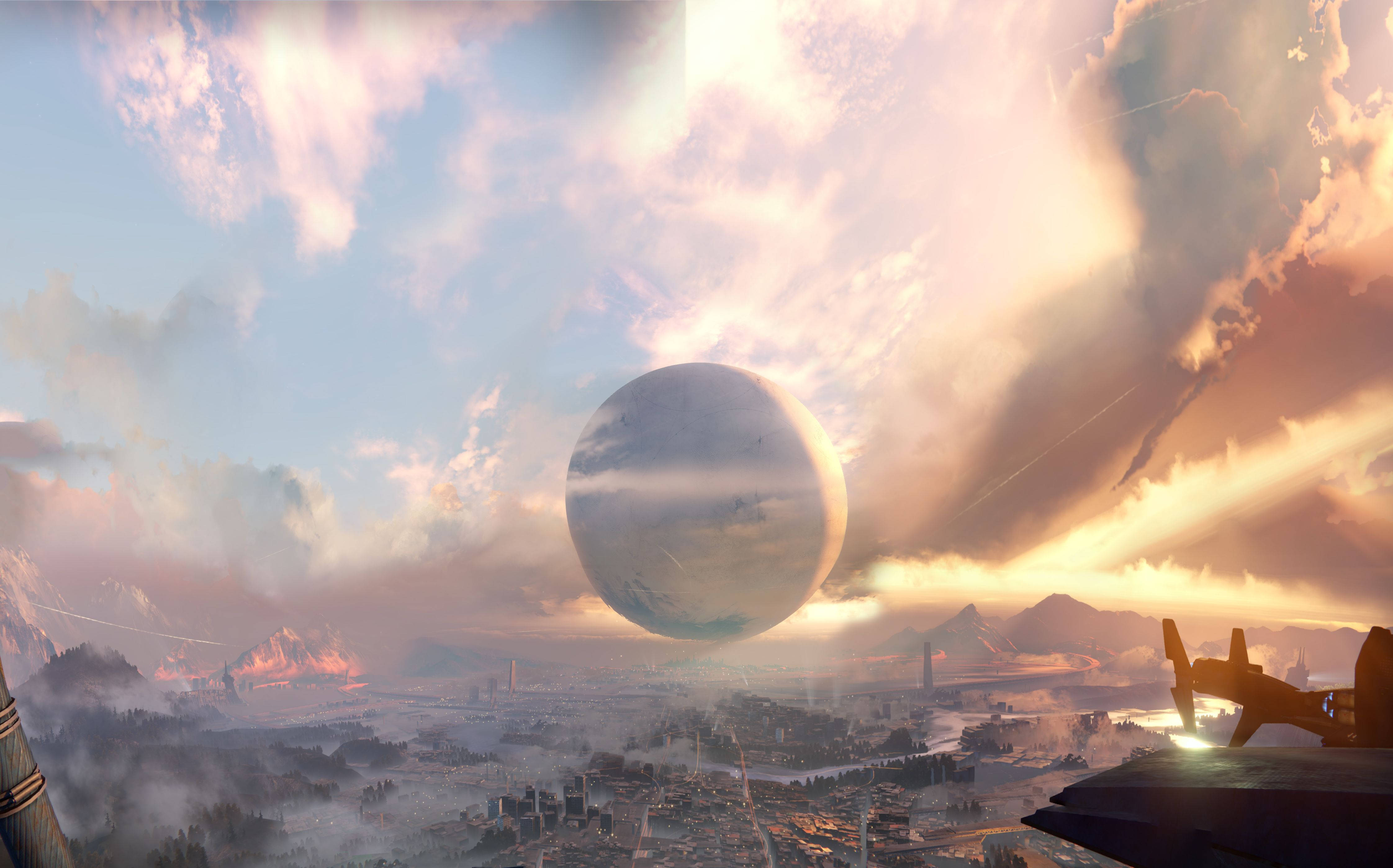 最後之城——《Destiny》宇宙的中心 壁紙 — 未來城市坐落在山脈中，下方是巨大的漂浮行星，夕陽西下。