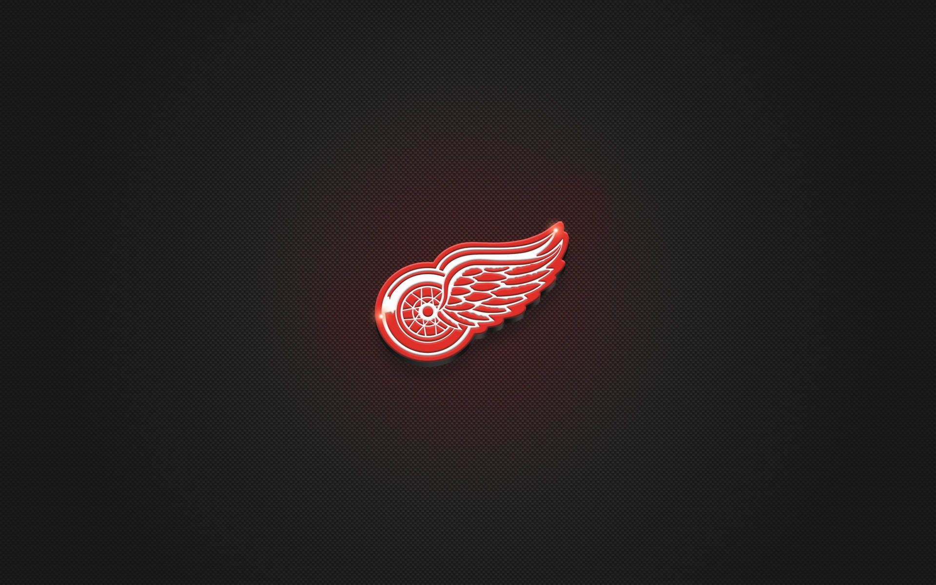 極簡黑色底 Detroit Red Wings 隊標 壁紙 — 一個發光的紅色底特律紅翼標誌，帶有白色點綴，居中在深色紋理背景上。