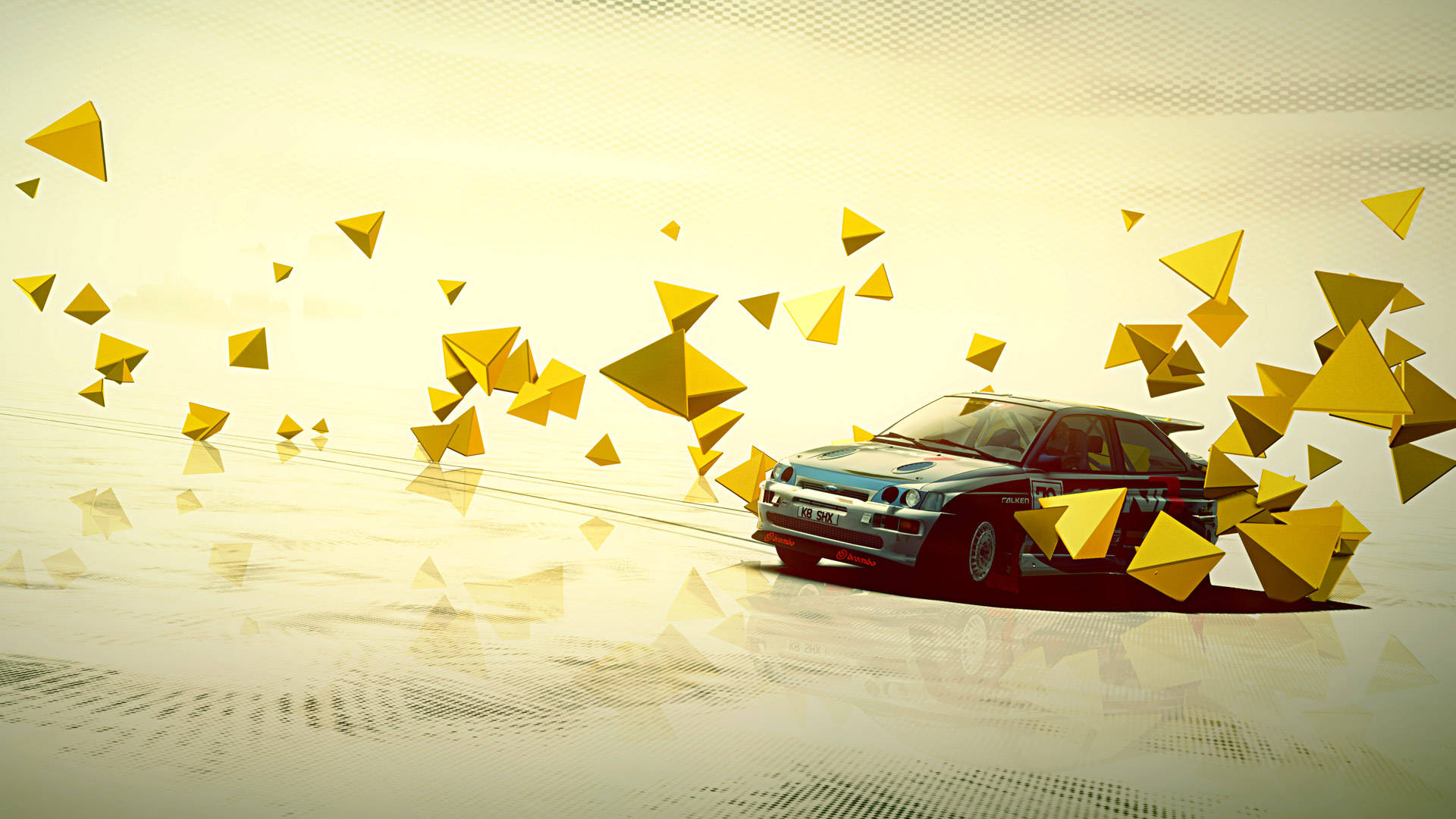 Dirt 3 福特 Cosworth 壁紙 — 一輛復古拉力賽車在反光表面上飛馳，揚起一陣金色幾何三角形，背景是朦朧的黃色。