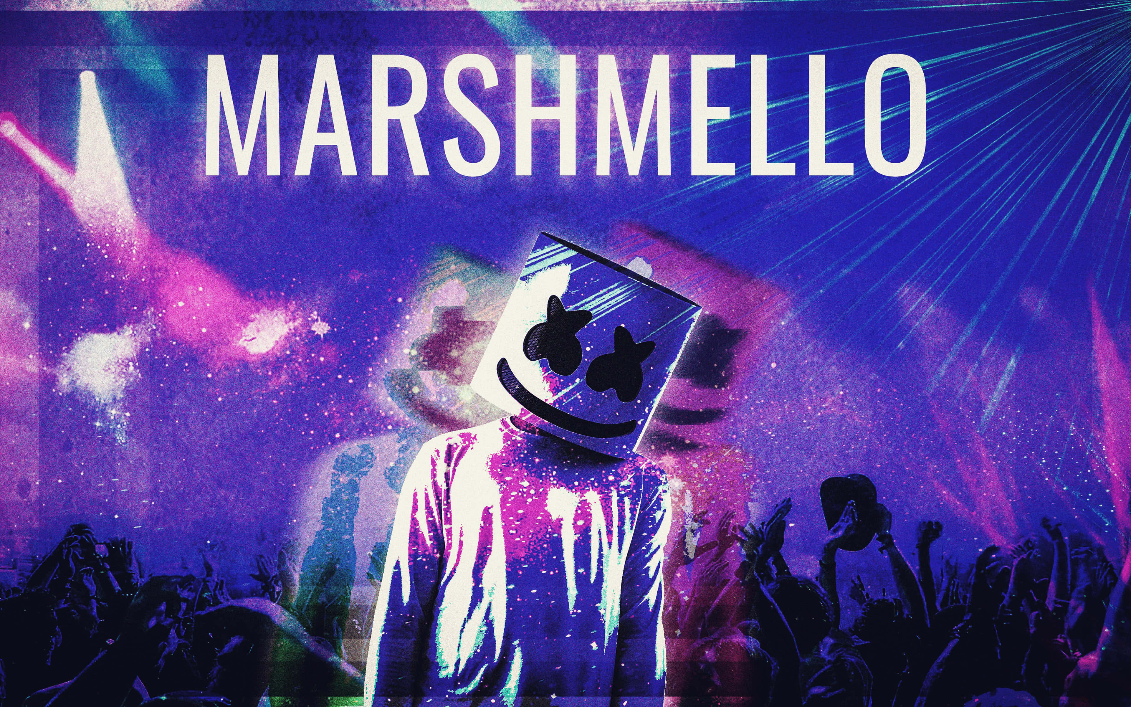 Marshmello 桌布 壁紙 — DJ Marshmello 在充滿活力的演唱會中表演，現場有發光的紫粉紅色燈光，下方是歡呼的人群。