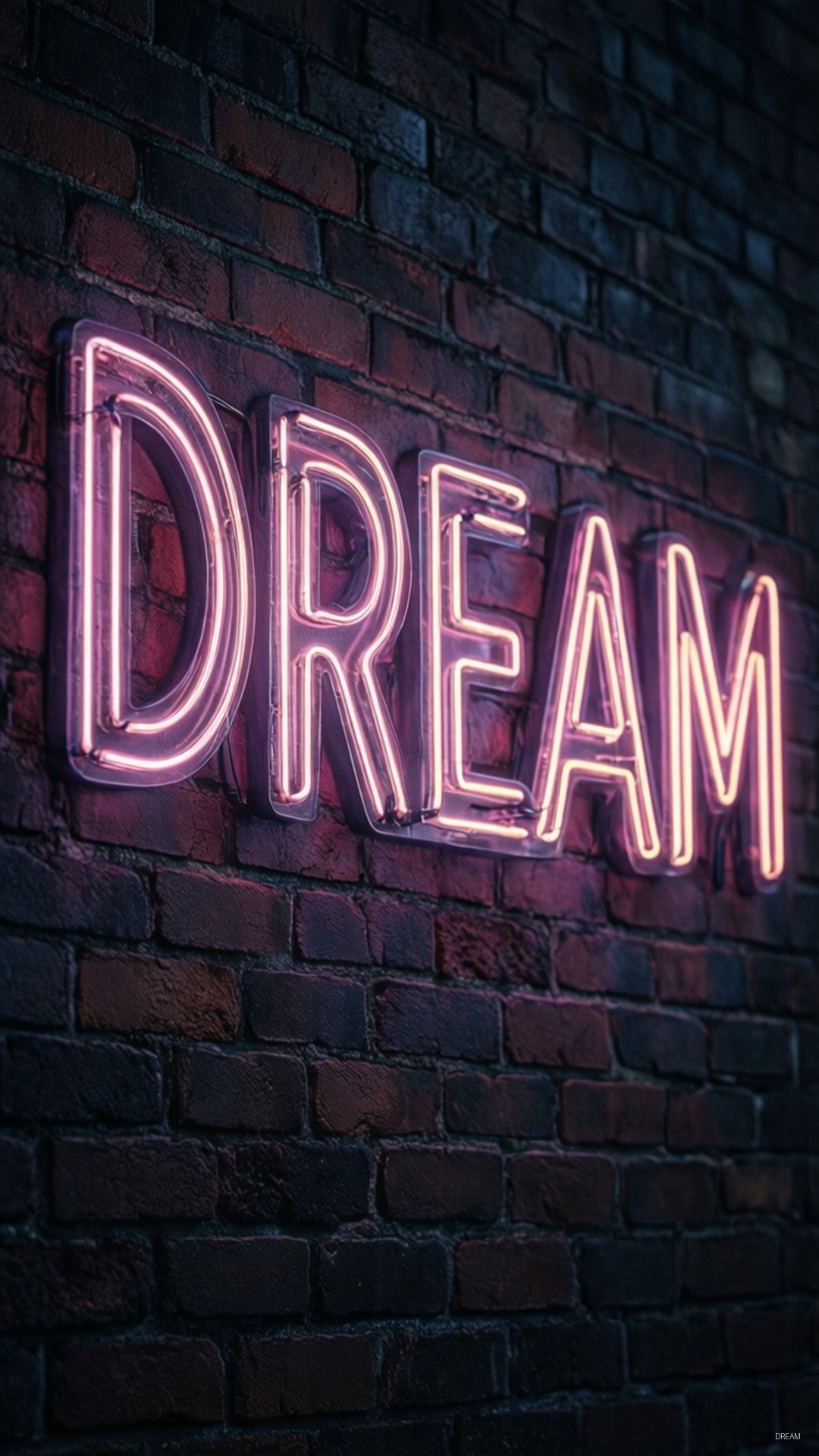 安裝在深色磚牆上的粉紅色霓虹燈牌，上面寫著dream