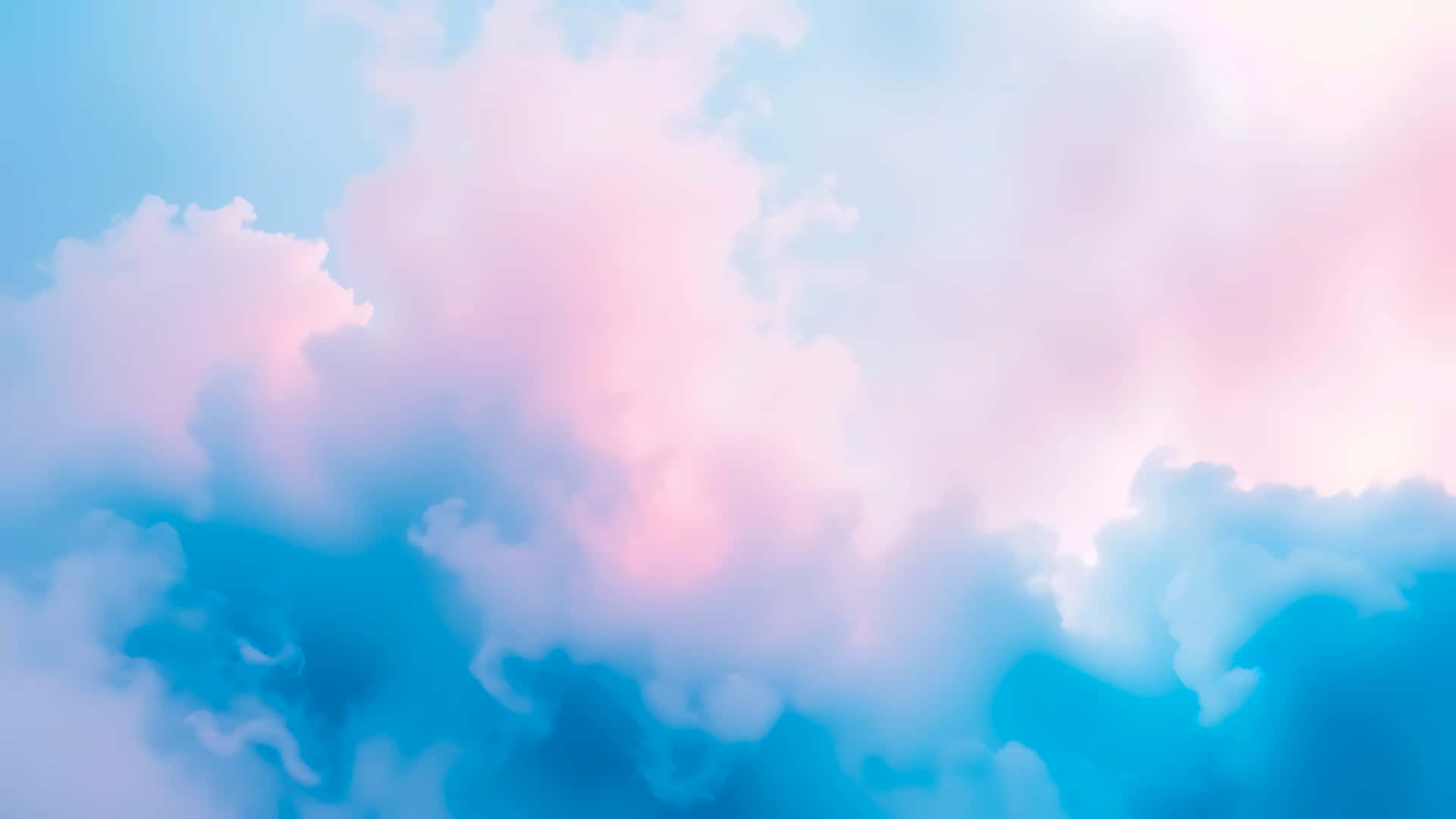 寧靜天空中飄浮的粉彩粉紅和藍色雲朵