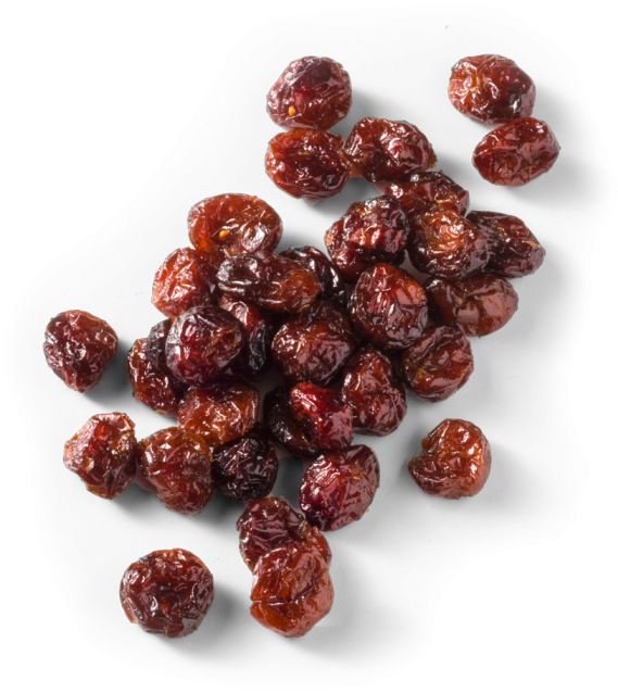 Dried Cranberries Top View 壁紙 — 一堆飽滿的深紅色乾蔓越莓散落在純黑背景上。