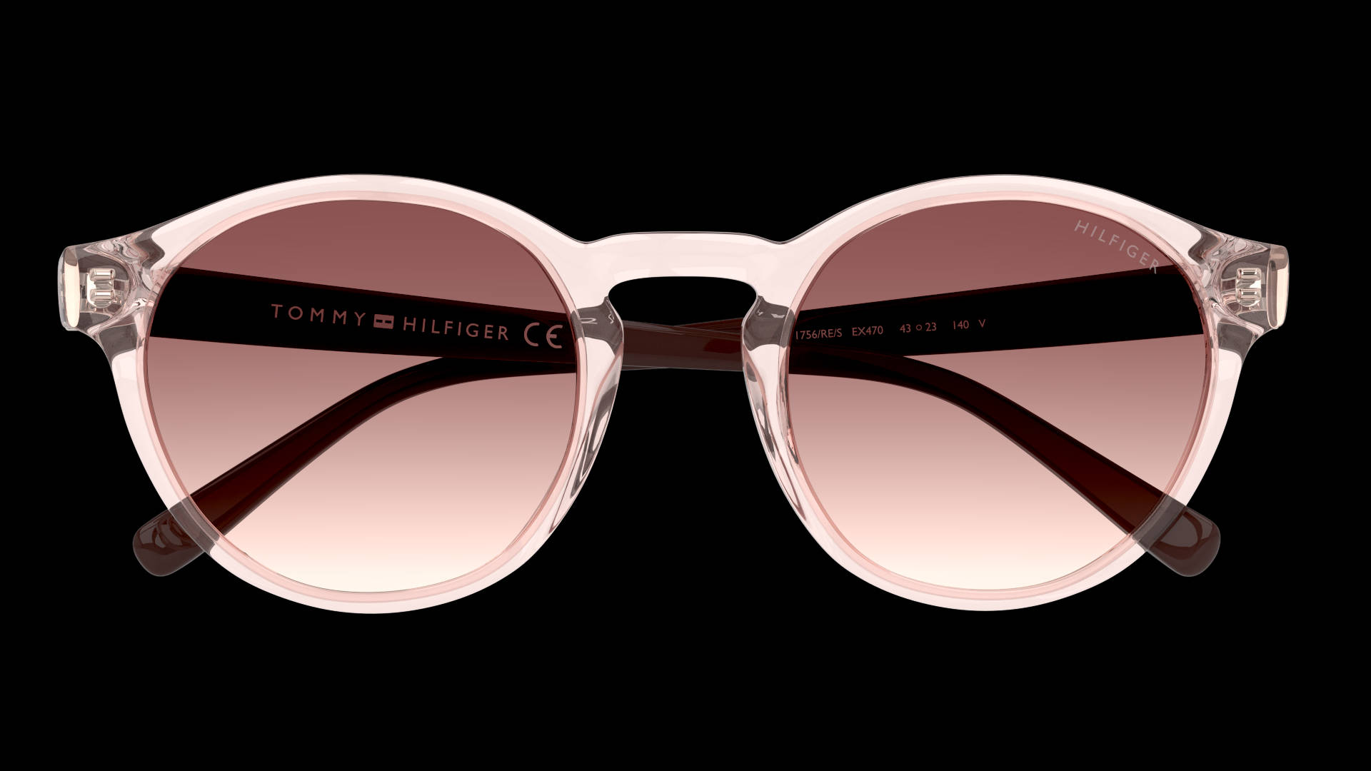 湯米·希爾費格 Eco 2.0 VALLUGA PNK 太陽眼鏡 壁紙 — Tommy Hilfiger 太陽眼鏡，配上半透明粉紅色鏡框和漸變玫瑰色鏡片，背景為黑色。