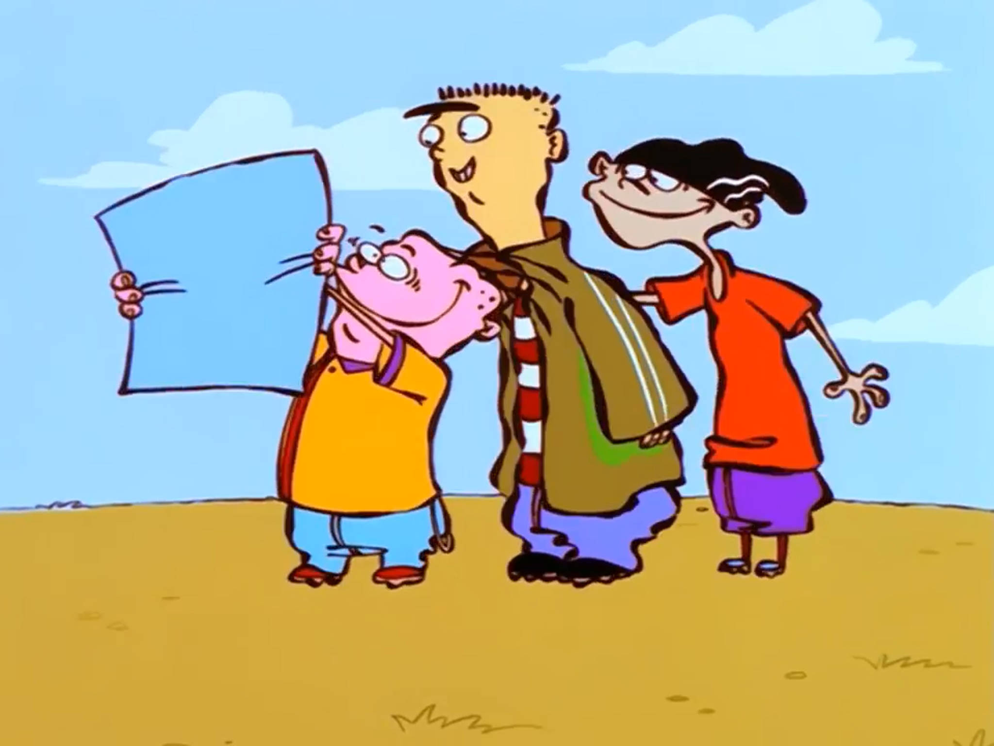 Ed Edd Eddy 查看紙張地圖 壁紙 — 三個卡通小孩站在沙質平原上，天空藍色，有蓬鬆的雲朵。其中一個拿著一個藍色正方形，其他小孩則帶著愉快表情觀看。