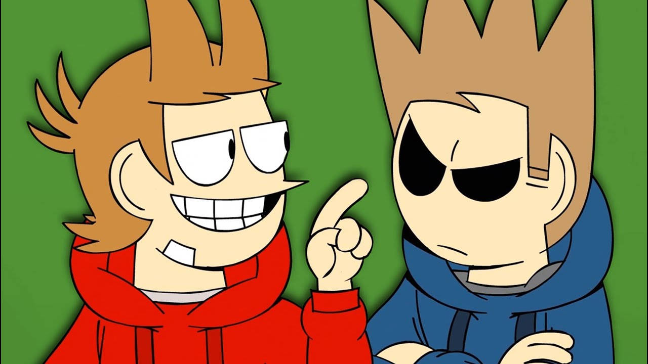 Eddsworld節目第一集 壁紙 — 兩個卡通男孩，頭髮尖尖，一個穿紅色連帽衫咧嘴笑著指向另一個穿藍色連帽衫、眼神憤怒的男孩，背景是純綠色。