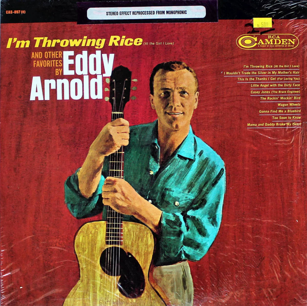 Eddy Arnold在紅色背景的復古專輯封面上手持原聲結他。