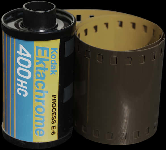 柯達Ektachrome 400HC膠卷 壁紙 — 一個復古的Kodak Ektachrome 400HC菲林罐，菲林部分拉出，背景為黑色。